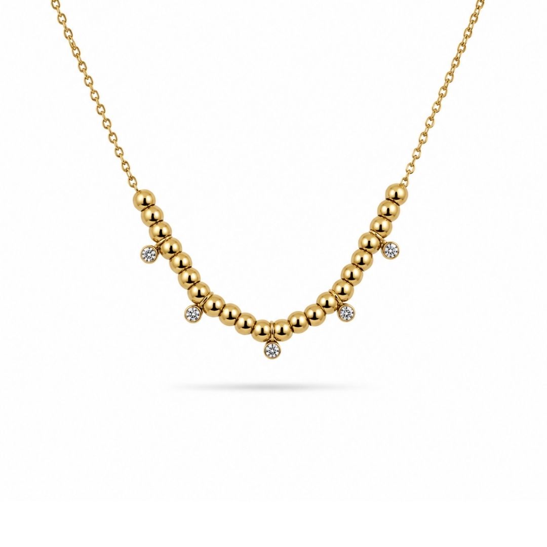 Gouden ketting met steentjes en kraaltjes