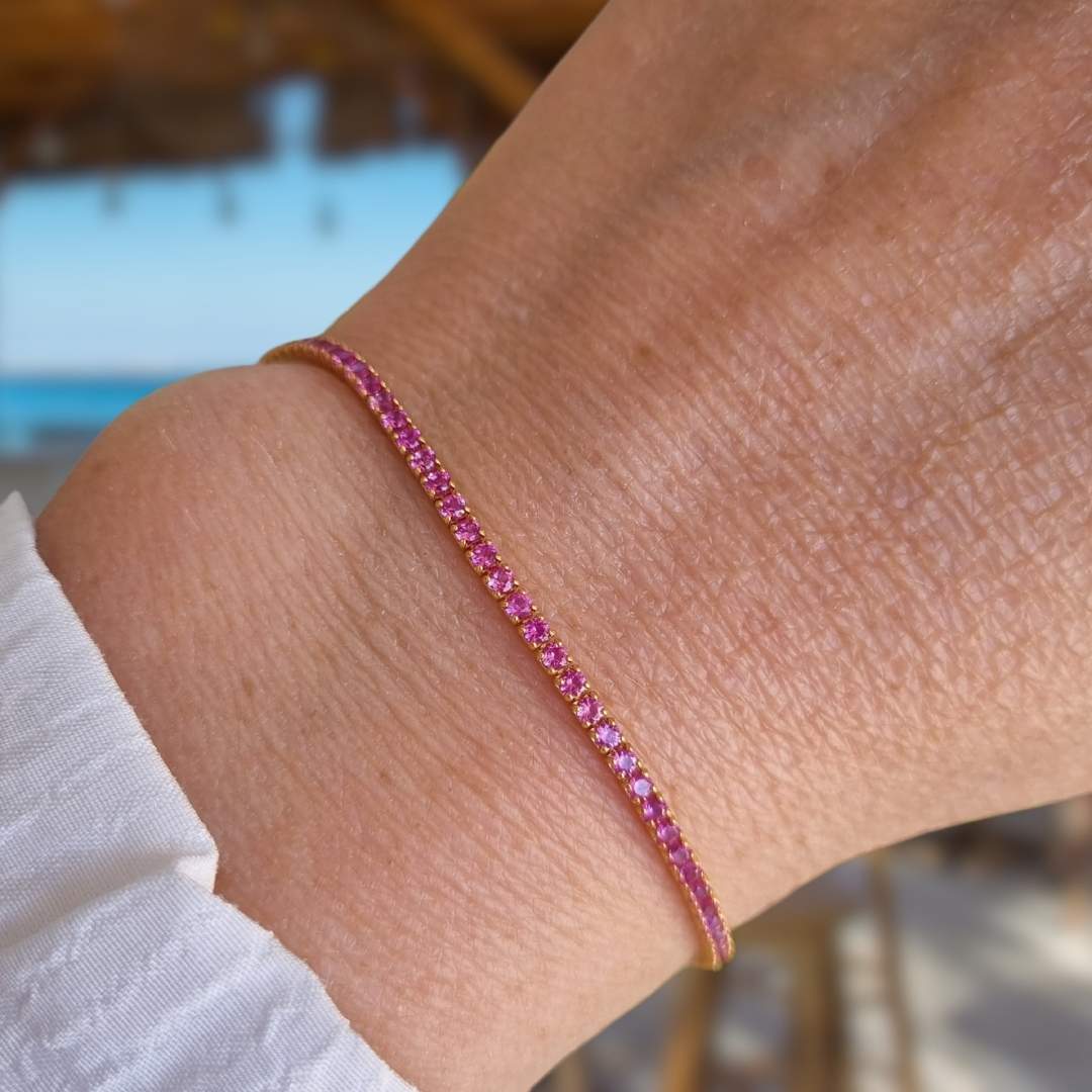 Gouden tennis armband met roze steentjes in verguld zilver