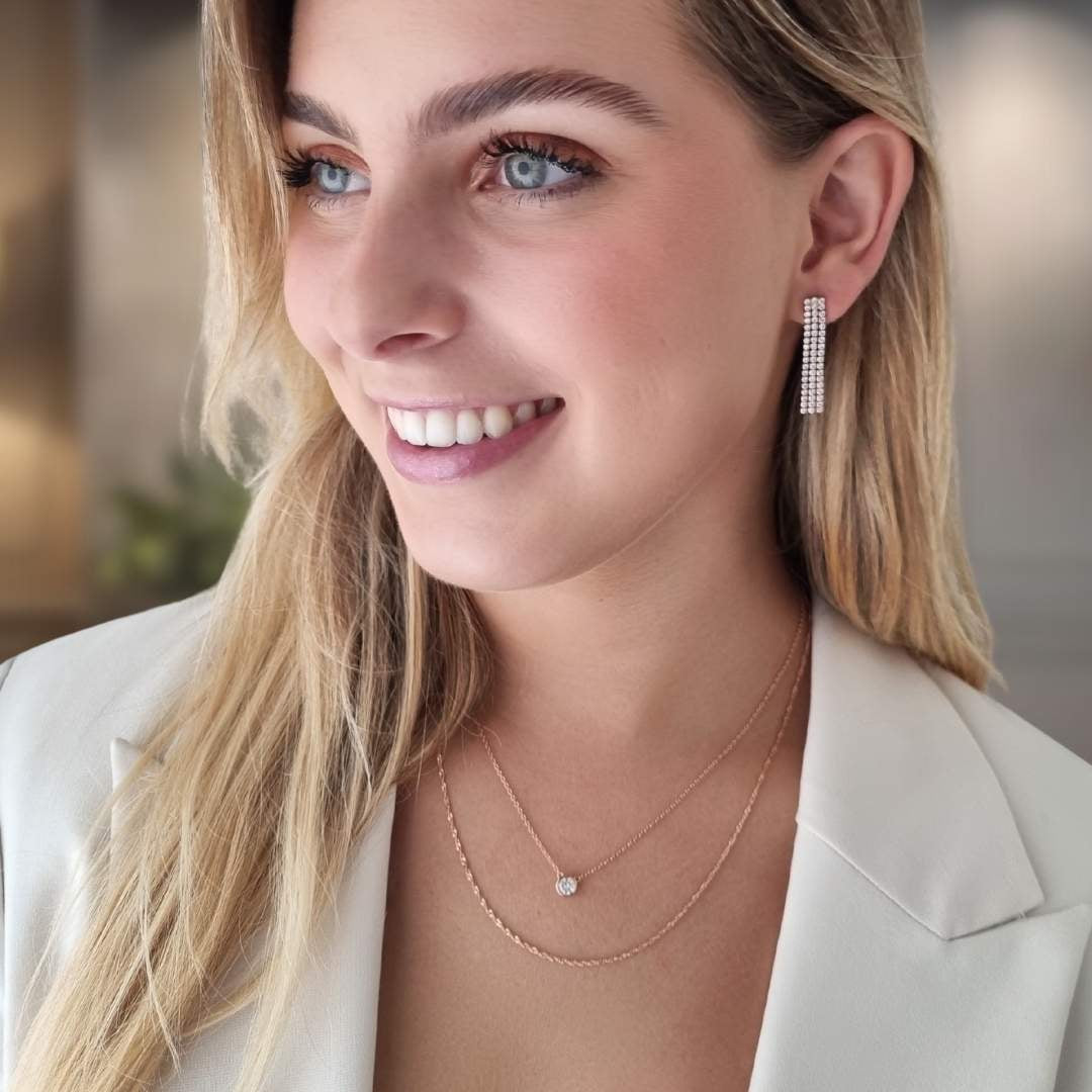 Rosé gouden oorbellen lang - rviere met steentjes