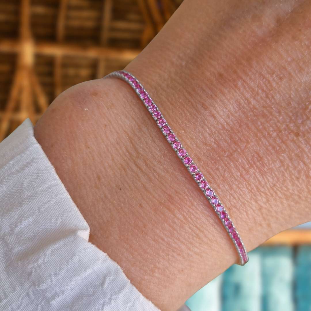 Zilveren tennisarmband met roze steentjes