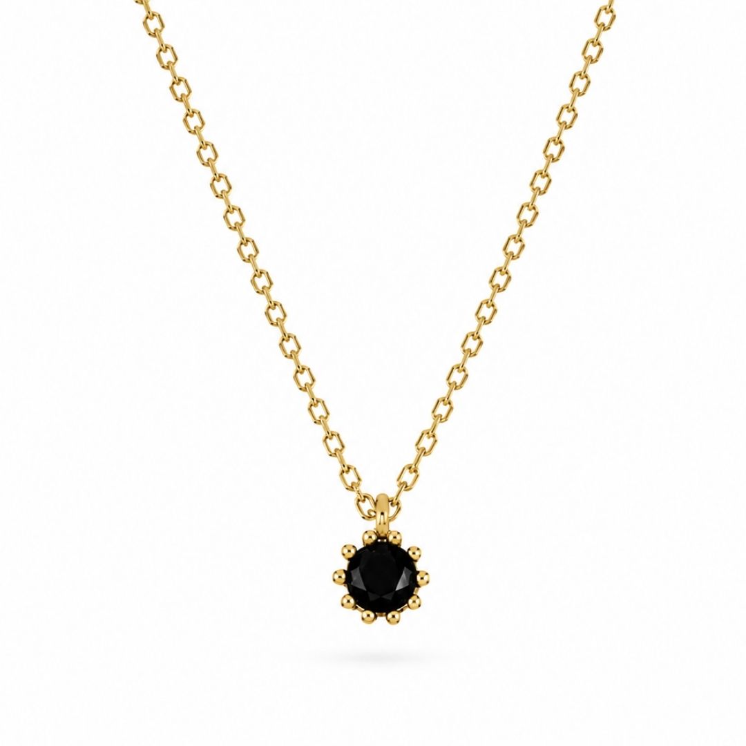 Gouden ketting met zwart steentje