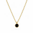 Gouden ketting met zwart steentje