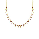 Gouden ketting met rode steentjes edelsteen