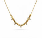 Gouden ketting met steentjes en kraaltjes