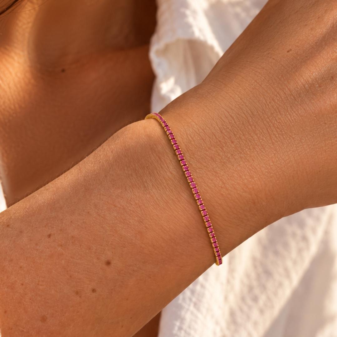 Tennisarmband goud roze steentjes 