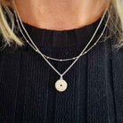 Zilveren ketting met munt hanger en azteken symbolen