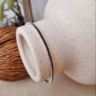 Zilveren tennisarmband vrouw met zwarte cubic zirkonia steentjes