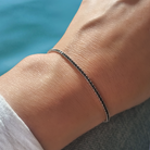 Zilveren tennisarmband met zwarte cubic zirkonia steentjes vrouw